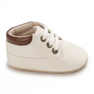 Detailed view of beige high-top baby walking shoes with soft soles and laces.