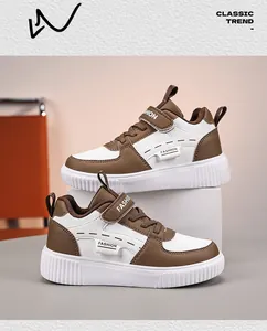 Side detail view of brown and white children's classic casual sneakers with velcro straps