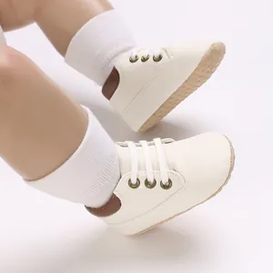Detailed view of cream PU leather baby pre-walker shoes with soft pebbled soles