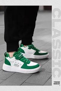 Children's green and white sneakers shown in an outdoor lifestyle setting