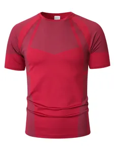 Detail of a red men's compression T-shirt featuring gray geometric patterned panels.