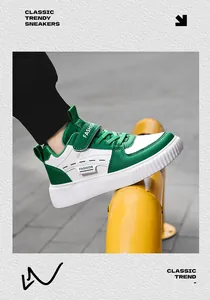 Side detail view of green and white children's fashion sneakers with velcro straps