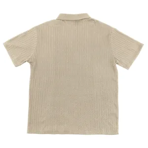 Back view detail of men's beige cable knit polo shirt showing premium texture and weave
