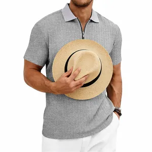 Detail showing grey knitted texture on a men's casual zip-up short sleeve Polo shirt