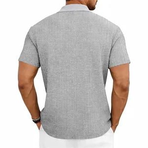Detailed back view of a grey knit polo shirt featuring a textured cable knit pattern.