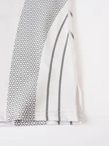 Detailed close-up showing the hem and grey honeycomb pattern of a white compression t-shirt