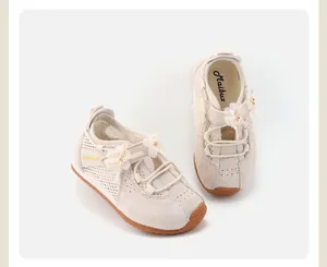 Detailed shot of beige toddler girls' breathable mesh sneakers with floral charms