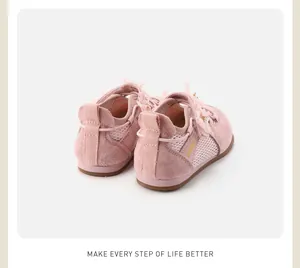 Close-up rear view of pink girls mesh sneakers featuring decorative mesh bow and pearl accents