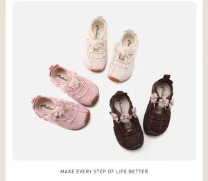 Stylish kids sneakers with floral decorations and bow accents in beige pink and brown colors