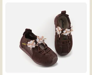Brown girls' sneakers with decorative flowers and pearl accents
