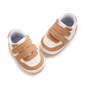 Soft-soled baby walking shoes in brown and white featuring double velcro straps design