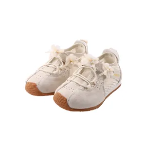 Elegant cream girls' sneakers with floral pearl accents and soft non-slip rubber soles