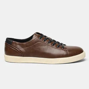 Side profile view of men's brown synthetic leather casual sneakers with brogue details