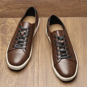 High-angle shot of brown faux leather men's casual shoes with white rubber soles
