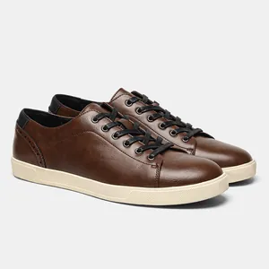 Detailed side view of men's brown casual faux leather sneakers with black lace-up design