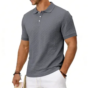 Detailed view of men's grey polo shirt featuring a distinctive V-shaped jacquard texture.