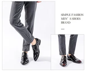Macro view of glossy black leather men's dress shoes, perfect for formal business wear.