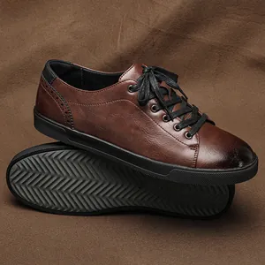 Detail view of brown leather casual sneakers with black laces and rubber non-slip sole