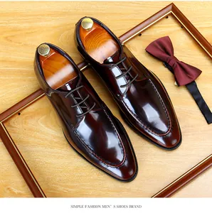 Premium burgundy patent leather men's formal dress shoes with stylish wooden shoe trees