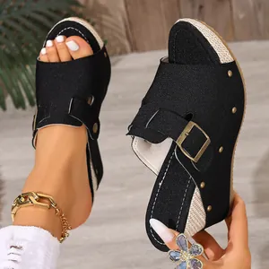 Black wedge platform sandals with canvas upper and metallic rivet details for women