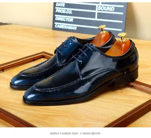 High-gloss navy blue leather derby shoes with elegant apron toe detail