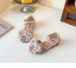 Elegant pink glitter princess shoes for girls with pearl-encrusted bow detailing