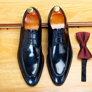 Glossy dark blue patent leather men's dress shoes for formal business occasions