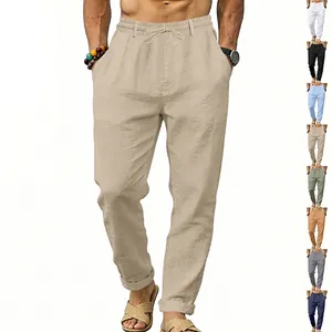Detail view of men's loose linen trousers with drawstring waist and color options