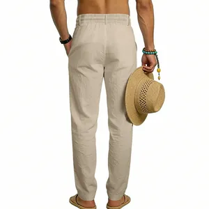 Back view of men's loose beige linen casual trousers featuring a comfortable elastic waist