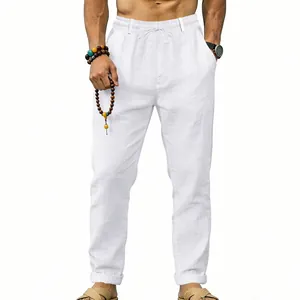 Front detail showing the fit and drawstring waist of white linen casual trousers for men