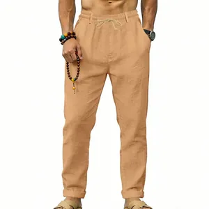 Men's tan linen casual trousers featuring a comfortable drawstring waist and straight leg