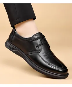 Macro view of black genuine leather men's business casual derby shoe with soft sole design