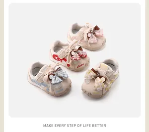 Detailed view showing four pairs of toddler girl mesh sneakers with plaid bows.
