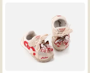 Detailed view of breathable mesh toddler girl sneakers featuring decorative plaid bows