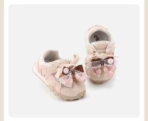 Detailed view of pink mesh toddler girl shoes featuring a decorative ribbon bow