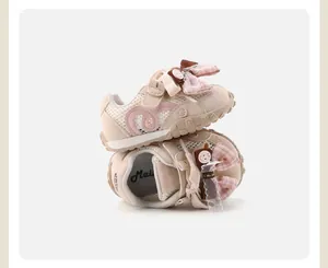 Detailed view of pink mesh baby girl sneakers featuring a stylish decorative ribbon bow