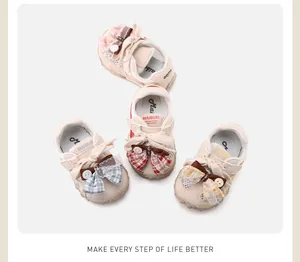 Detailed view of breathable toddler mesh sneakers with decorative plaid bow accents