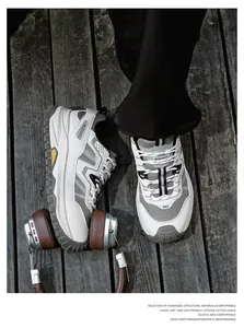 Detail view of breathable mesh safety sneakers with comfortable MD soles and stylish design.