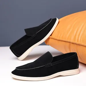 Black suede loafers for men with British style, retro slip-on design with white rubber sole.