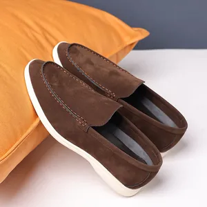 Close-up detail showing the soft brown suede material of retro casual English loafers