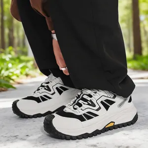 Black and white breathable mesh safety sneakers with durable MD lug sole for outdoor work.