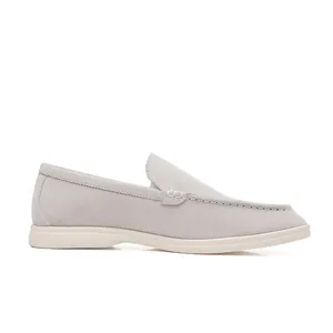 Side view of Men's grey suede loafers with white rubber sole for a casual retro look