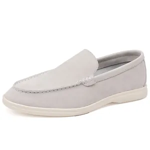 Detailed view of the side and stitching on grey suede slip-on casual loafers