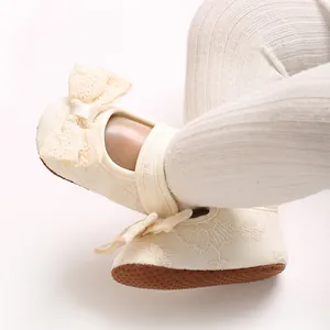 Close-up of baby girl lace bow shoes with floral embroidery and soft non-slip sole