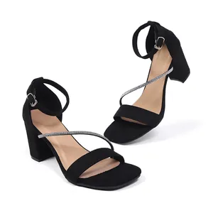 Elegant black block heel sandals featuring sparkling rhinestone strap details for summer.