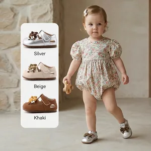 Toddler girls' silver soft sole walking shoes with cute bow knot and breathable design.