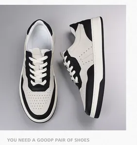 Vista dettagliata che mostra la pelle martellata e i fori traspiranti delle sneaker bianco e nero
