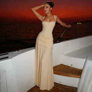 Detailed view of an elegant light yellow ruched maxi dress featuring a square neckline and high waist
