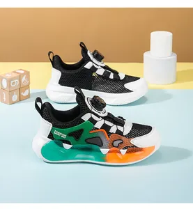 Detail view of breathable mesh kids sneakers with colorful accents and knob lacing system.