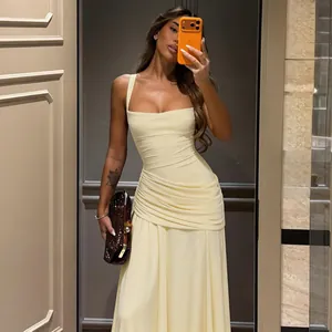 Elegant pale yellow ruched square neck maxi dress with slim fit and stylish draping detail.